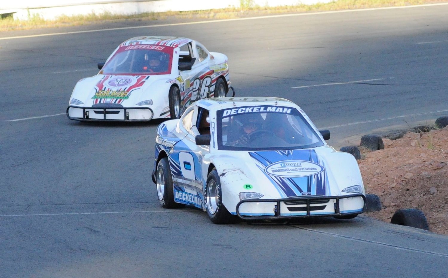 In the lead. Monika Deckelman holds off 12-year-old Leland Oefelein-Brush in car #26 during a series of practice laps.